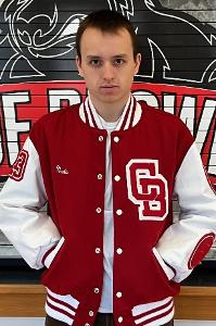 Student athlete wearing a Coe-Brown varsity letterman jacket